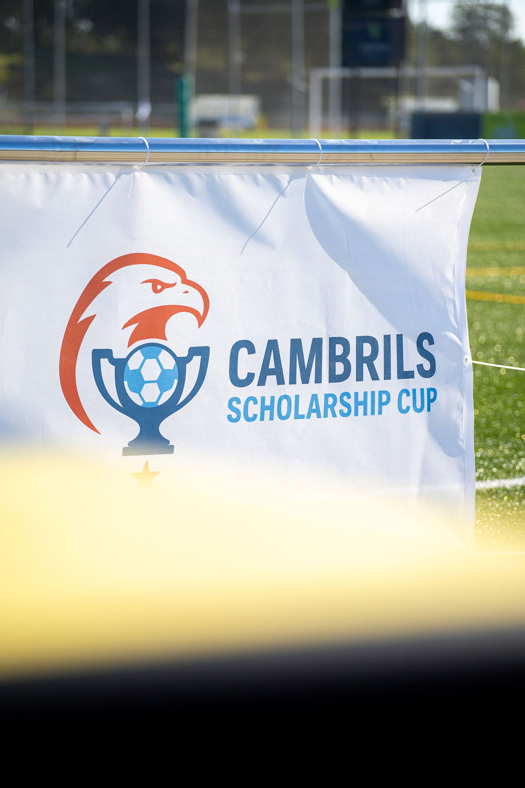 Cambrils Scholarship Cup banner at the tournament venue